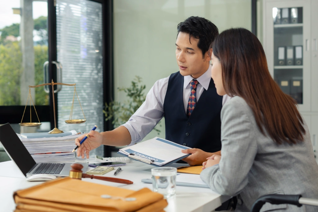 man and woman working in a boardroom